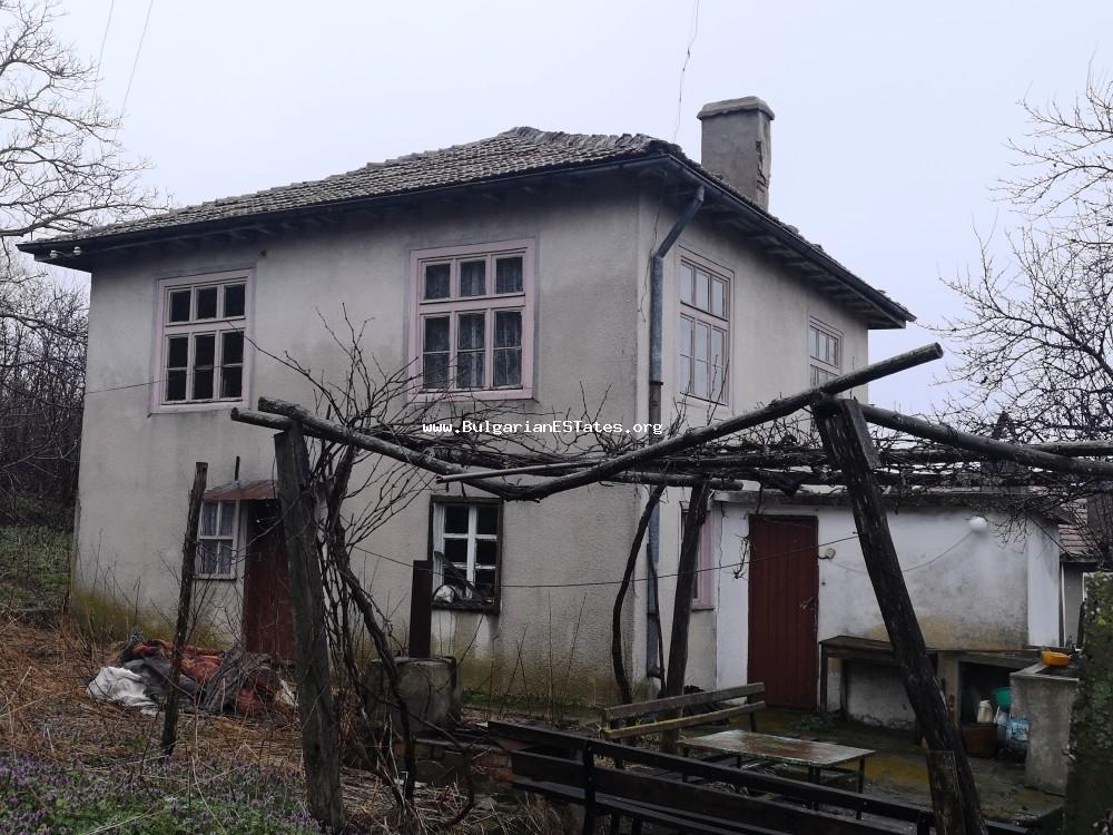Affordable two-storey house is for sale with a beautiful view of the village of Bulgari, the highlands of Strandzha Planina, 18 km from the town of Tsarevo and the sea.