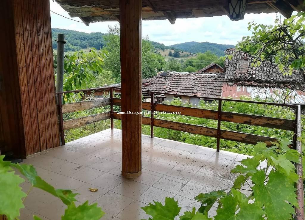 We offer for sale a two-storey house with stunning views, located in the heart of the Strandzha Mountains, just 50 km from the city of Burgas and the Black Sea, the village of Golyamo Bukovo, Bulgaria.